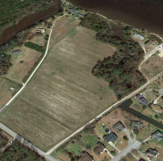 Partner’s Forced Bankruptcy Sale: 16.8± Acres Primed for Development with Waterfront Views.